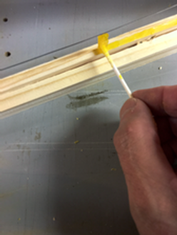 Apllying wax with cotton swab Apllying wax with cotton swab