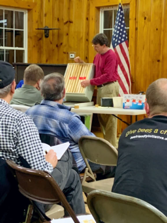 Avery County beekeeper teaching HCBA members about drone tarpping.