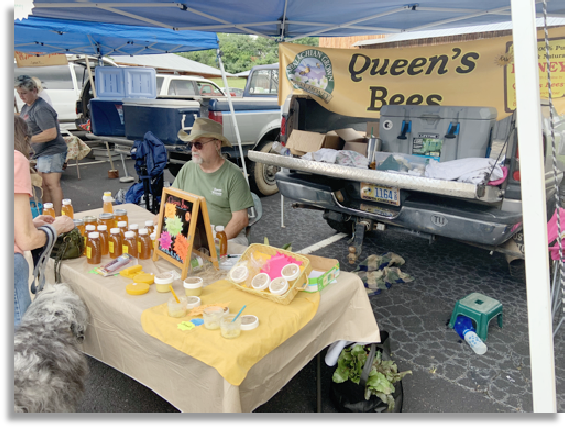 Rick Queen selling honey at the Waynesville, NC Farmer's Market.